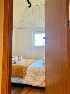 Postel nebo postele na pokoji v ubytování Cozy House with Douro View