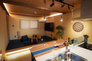 a living room with a couch and a table at Tabiudo Stay Miyajima 01-02 - Vacation STAY 20513 in Fukae