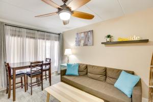 a living room with a couch and a table at Wildwood Condo with Community Pool Walk to Beach! in Wildwood