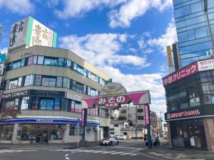 a busy city street with a building with signs on it at Wakayama - House - Vacation STAY 64124v in Wakayama