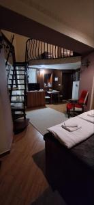 a bedroom with a bunk bed and a spiral staircase at Apartment Danubius in Belgrade