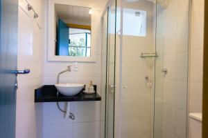 a bathroom with a sink and a shower at Hostel Jardim das Bruxas 410 in Florianópolis +98 photos