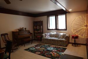 a living room with a couch and a table at Cirque Stay in Lawrence +20 photos