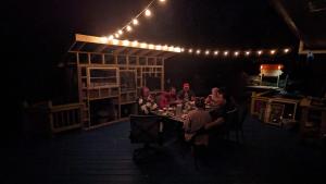 a group of people sitting at a table in the dark at Cirque Stay in Lawrence