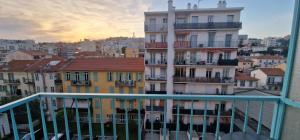 a view of a city from the balcony of a building at Le Cocon de la Prom in Nice