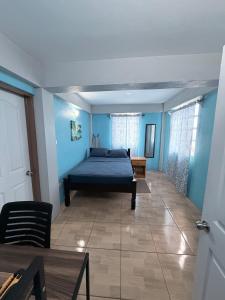 Ένα ή περισσότερα κρεβάτια σε δωμάτιο στο M&G City View Apartments