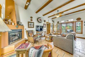 a living room filled with furniture and a fireplace at Comfy Aspen Ridge Home about 3 Mi to Ski Lifts in Cloudcroft