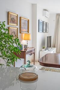 a living room with a desk and a table at Spacious 3-Bedroom Apartment with Balconies-Central Sliema in Sliema