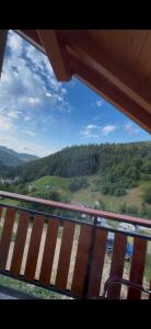 a view from a balcony with a view of a mountain at Cabana 5 Banuti in Statiunea Borsa