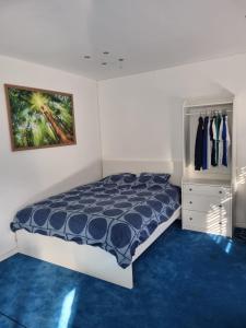 Ένα ή περισσότερα κρεβάτια σε δωμάτιο στο Le Jardin