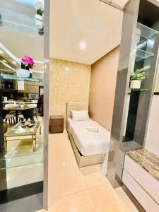 a bedroom with a bed and a dining room at Dorsett Residences Executive KL in Kuala Lumpur