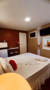 Postel nebo postele na pokoji v ubytování Paradies Hotel e Motel