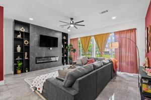 a living room with a couch and a tv at The Diamanti 3BD In the Heart of Dallas in Dallas