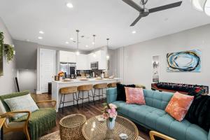 a living room with a couch and a table at JoyFull 2BD In the Heart of Magnolia in Fort Worth