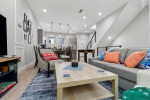 a living room with a couch and a table at The Euclase 2BD TownHouse in the heart of FortWorth in Fort Worth
