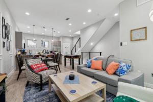 a living room with a couch and a table at The Euclase 2BD TownHouse in the heart of FortWorth in Fort Worth