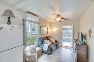 a living room with a couch and a ceiling fan at 2 Mi to Dtwn Atascadero! Cozy Cottage with Yard in Atascadero