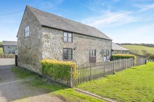 an old stone house with a fence at 2 Bed in Whitwell oc-r33497 in Whitwell