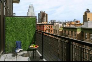 a balcony with a view of a city at Merchant LES in New York