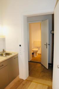 a bathroom with a sink and a toilet at Central Apartment Nördlingen in Nördlingen +11 photos