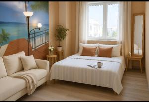 a bedroom with a white bed and a couch at Arguinegin Gran Canaria Near the Beach with ocean view in Arguineguín +6 photos