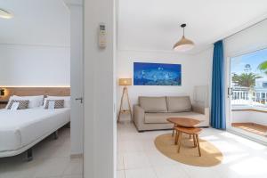 Postel nebo postele na pokoji v ubytování Hotel Arena Beach