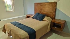 Postel nebo postele na pokoji v ubytování Hotel La Estancia