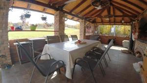 a dining room with a table and chairs in a building at Red Brick 