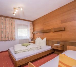 Postel nebo postele na pokoji v ubytování Piz Arina Inklusiv Premium - Card