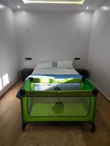 Ένα ή περισσότερα κρεβάτια σε δωμάτιο στο Chez babayo