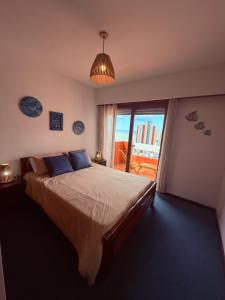 En eller flere senge i et værelse på Edificio Romeo IV