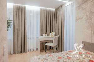 Ένα ή περισσότερα κρεβάτια σε δωμάτιο στο SarkuGuzta Cozy Apartment