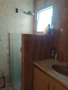 a bathroom with a shower and a sink and a sink at Sebastião Arruda Júnior Recife Boa Vista in Recife