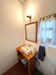 a bathroom with a sink and a mirror at Loft en La Juanita in José Ignacio