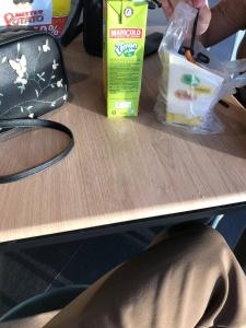 a table with a carton of milk and a box of cereal at pina in Bintulu