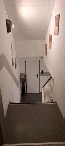 a view of a staircase with a white stair case at Schneeglöckchen in Marl