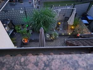an overhead view of a patio with plants and an umbrella at Schneeglöckchen in Marl
