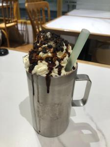 a ice creamifle in a cup with a green straw at pina in Bintulu