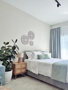 Ένα ή περισσότερα κρεβάτια σε δωμάτιο στο Grace Living - Studio 204