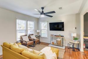 a living room with a couch and a ceiling fan at 2 Blocks to ATandT Stadium World Cup Location in Arlington