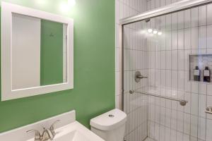 a bathroom with a white toilet and a shower at 2 Blocks to ATandT Stadium World Cup Location in Arlington +19 photos