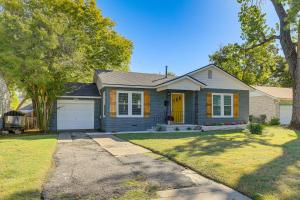 a house with a yellow door and a yard at 2 Blocks to ATandT Stadium World Cup Location in Arlington