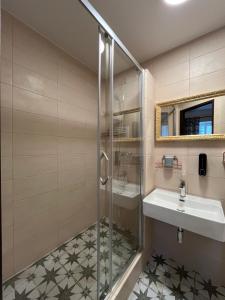 a bathroom with a shower and a sink at Art Maison Krumlov in Český Krumlov +75 photos