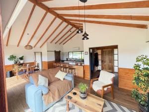 a living room with a couch and a table at Casa Pradera in Frutillar