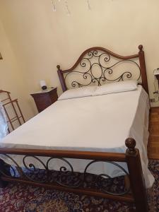 Ένα ή περισσότερα κρεβάτια σε δωμάτιο στο B&B Giovanni e Rosy