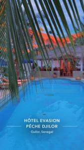 a poster for a hotel evacuation people dollarlier in a building at Hôtel évasion pêche djilor île sine saloum in Fatick