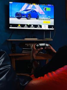 TV a/nebo společenská místnost v ubytování Escape Inn + 9 fotografií