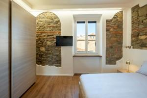 En eller flere senge i et værelse på Terra d'Arezzo