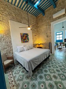 Voodi või voodid majutusasutuse Casita de la 12 5 min a centro Campeche ideal para 2 ó 3 personas Cocina con estufa de inducción, microondas y refrigerador toas