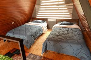 Ένα ή περισσότερα κρεβάτια σε δωμάτιο στο Guayacanes Ecolodge